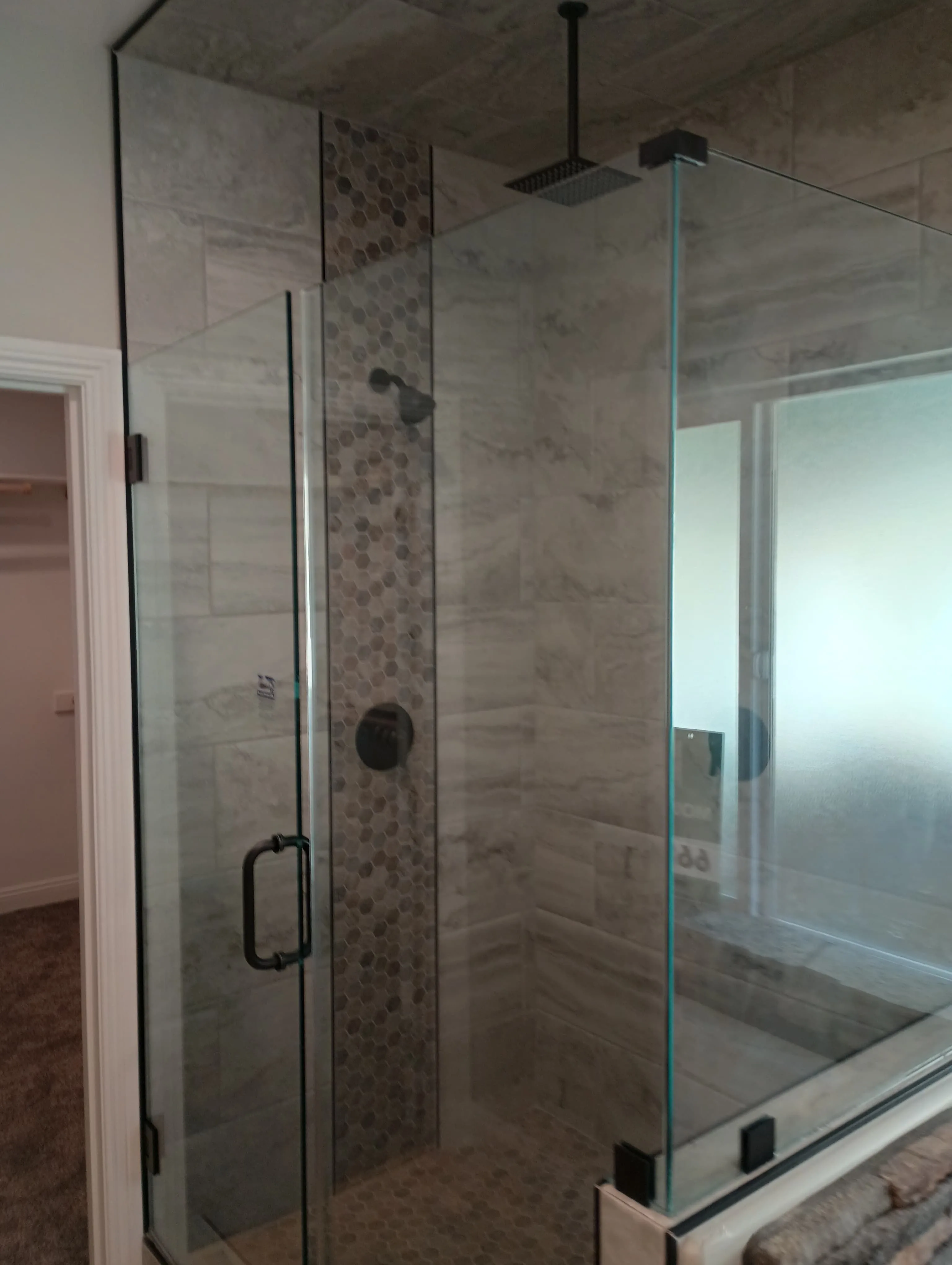Modern hexagon mosaic shower with frameless glass
